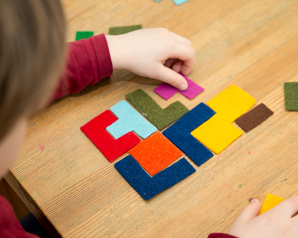 Child doing an IQ test and Assessment of Cognitive Abilities